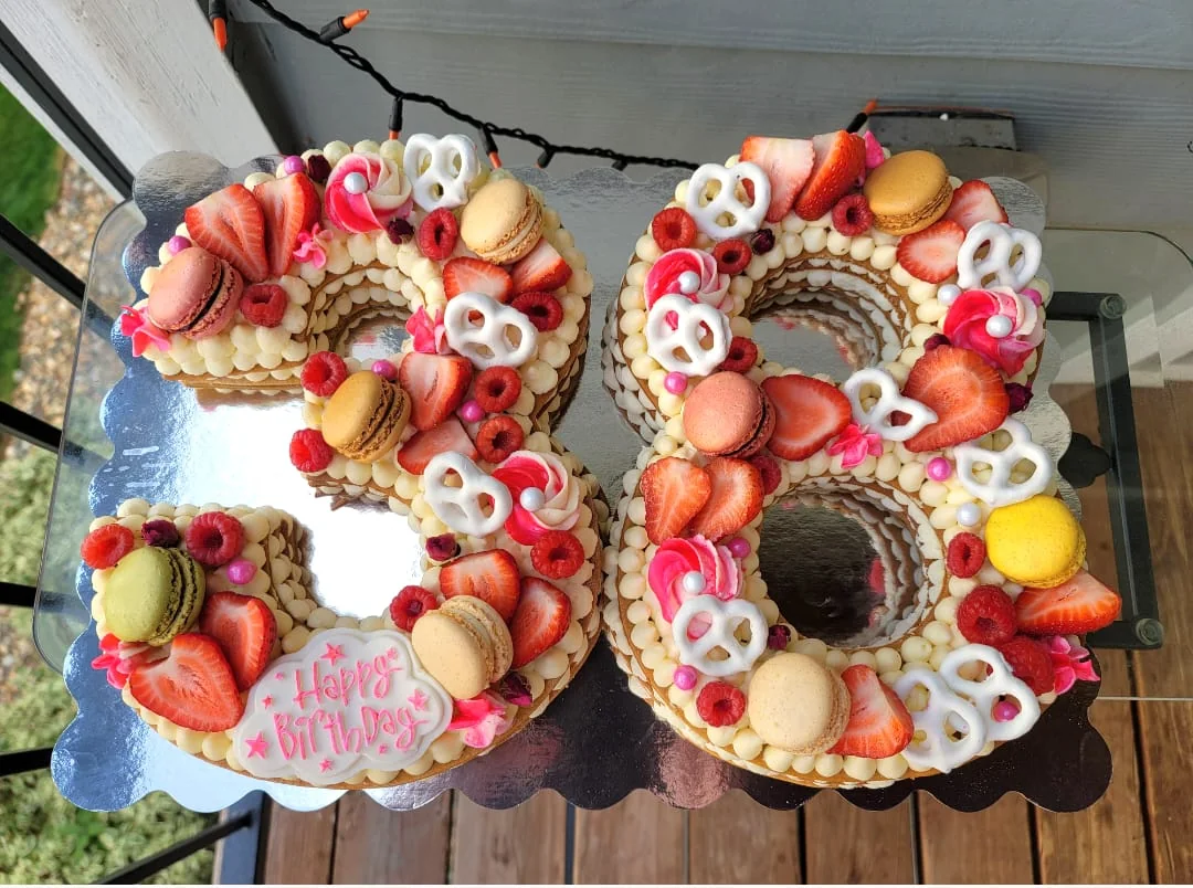 Number 38 custom cake with berries and macarons